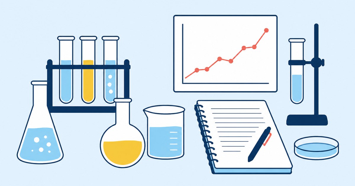 Laboratory glassware, test tubes, a line chart, and a lab notebook are arranged on a workbench