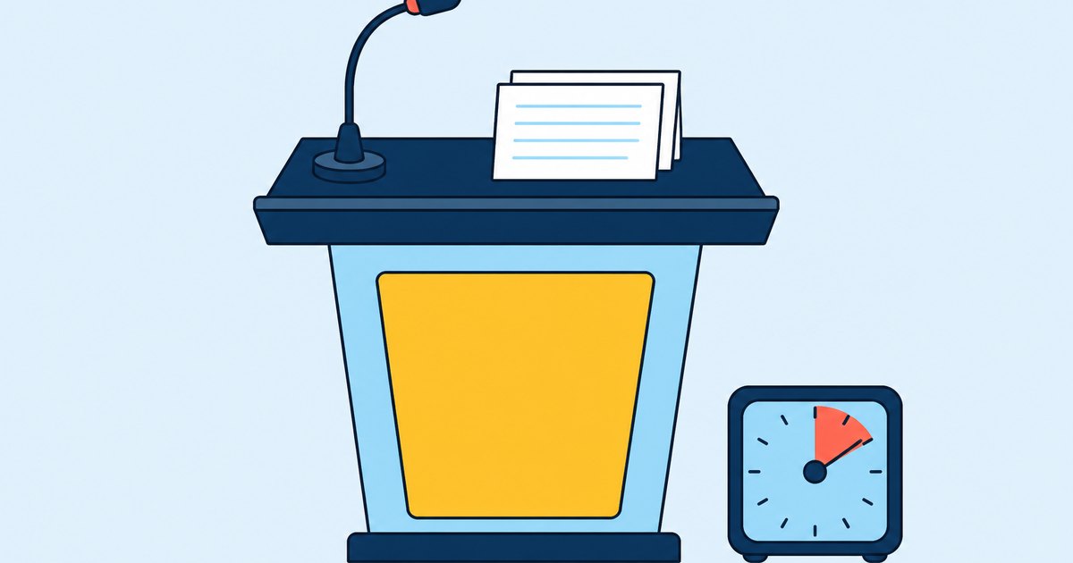 A lectern, a microphone, cue cards, and a timer are arranged on a presentation stage