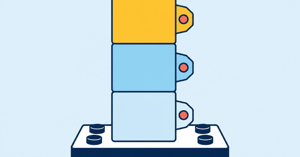 Three blocks form a tower on a base plate, with index tabs attached to each block